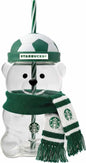 Clear Starbucks bear shaped glass cup with green soccer ball lid and striped straw