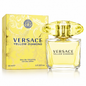 Versace Yellow Diamond Eau de Toilette natural spray bottle with a faceted yellow cap, shown next to its yellow patterned retail box on a white background.