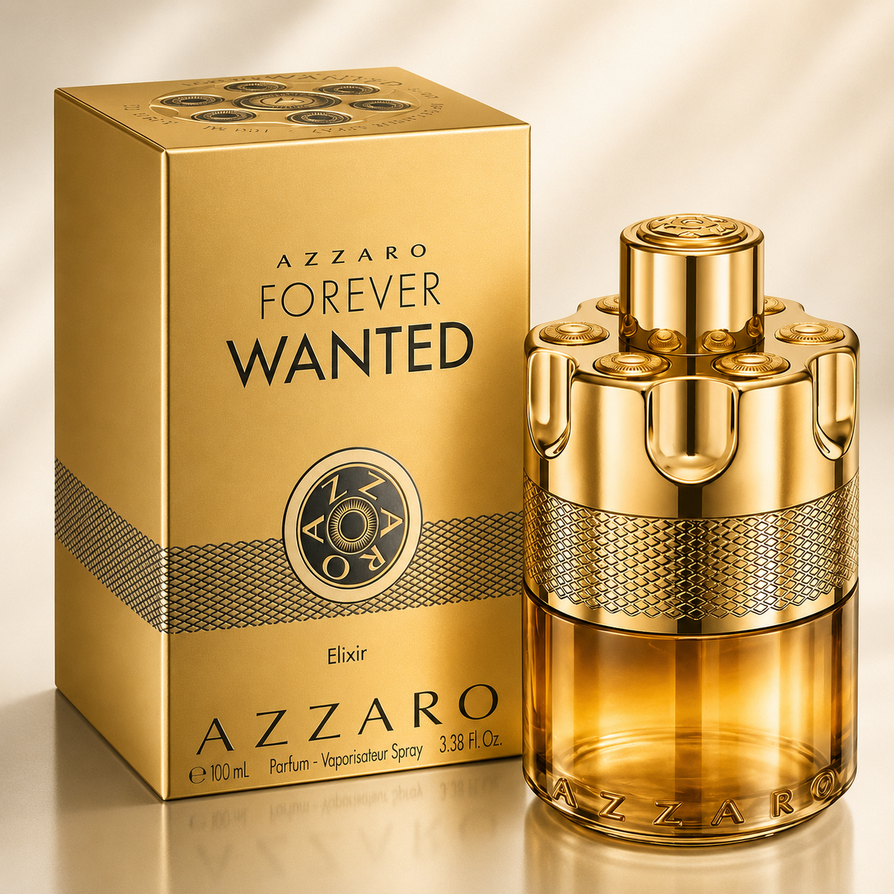 Azzaro Forever Wanted Elixir perfume bottle and its matching gold box, displayed on a reflective gold surface with a soft beige background.
