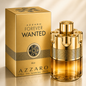Azzaro Forever Wanted Elixir perfume bottle and its matching gold box, displayed on a reflective gold surface with a soft beige background.