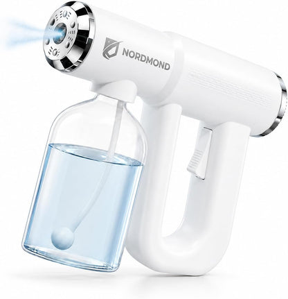 Cordless rechargeable electric spray mister releasing a fine cleaning mist