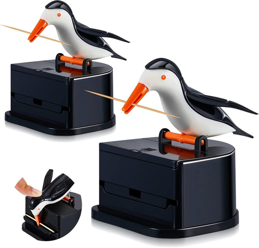 Set of 2 cute woodpecker toothpick dispensers on a dining table
