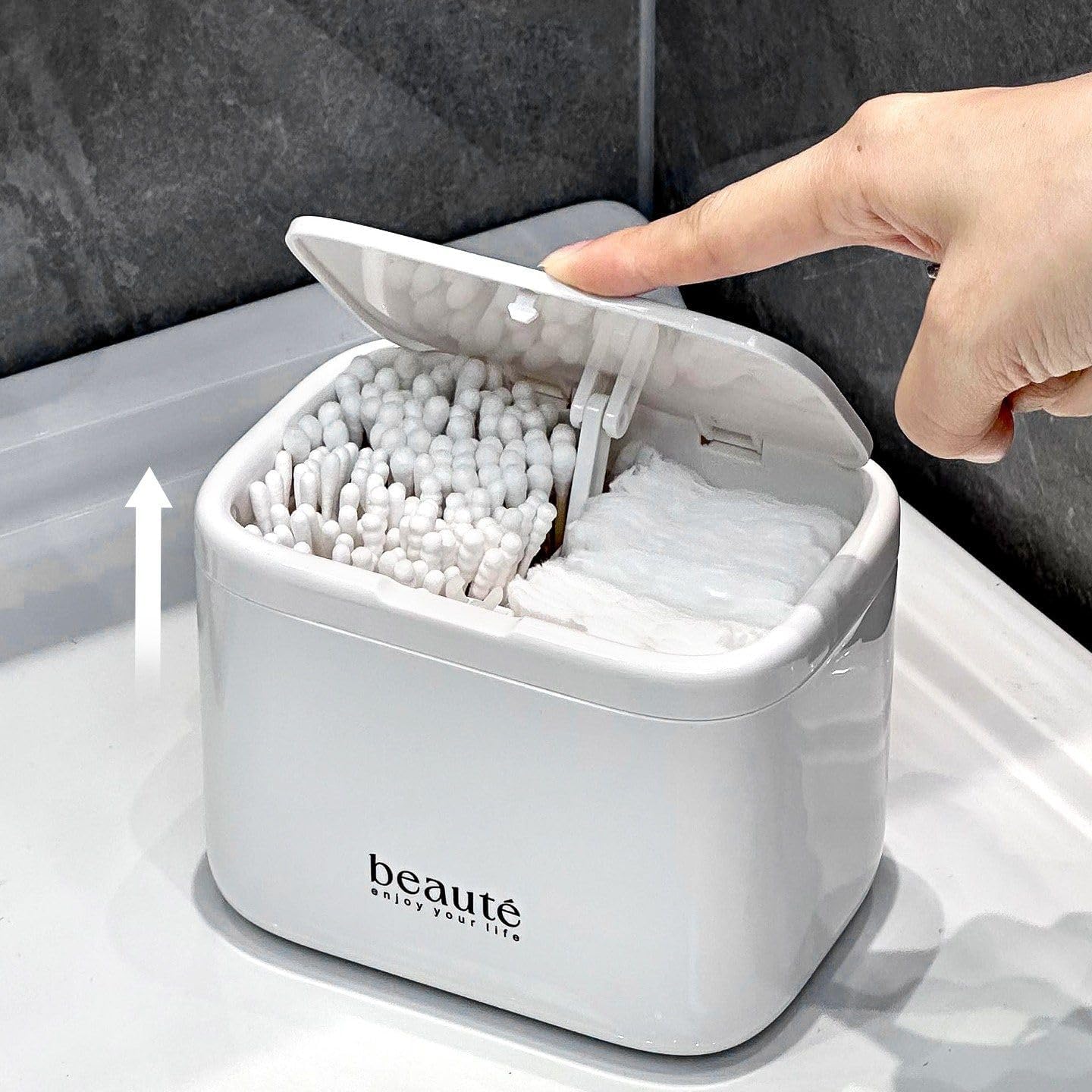 White pop-up cotton swab holder with 4 compartments mounted on bathroom wall